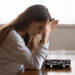 woman with head in hands, taking the gad test
