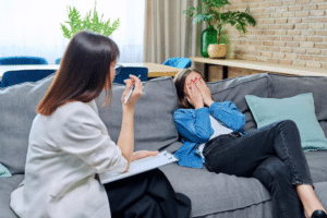 female having a panic attack during therapy session