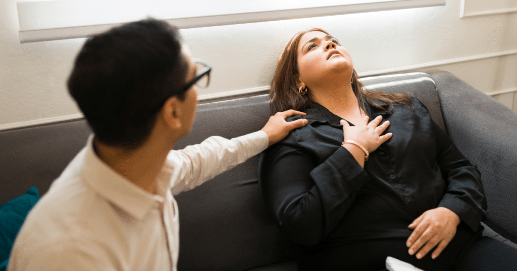 Woman receiving treatment while having a panic attack