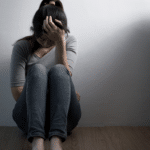 Woman struggling with the causes of depression