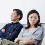 a couple sitting on the couch together, experiencing disorganized attachment in adults