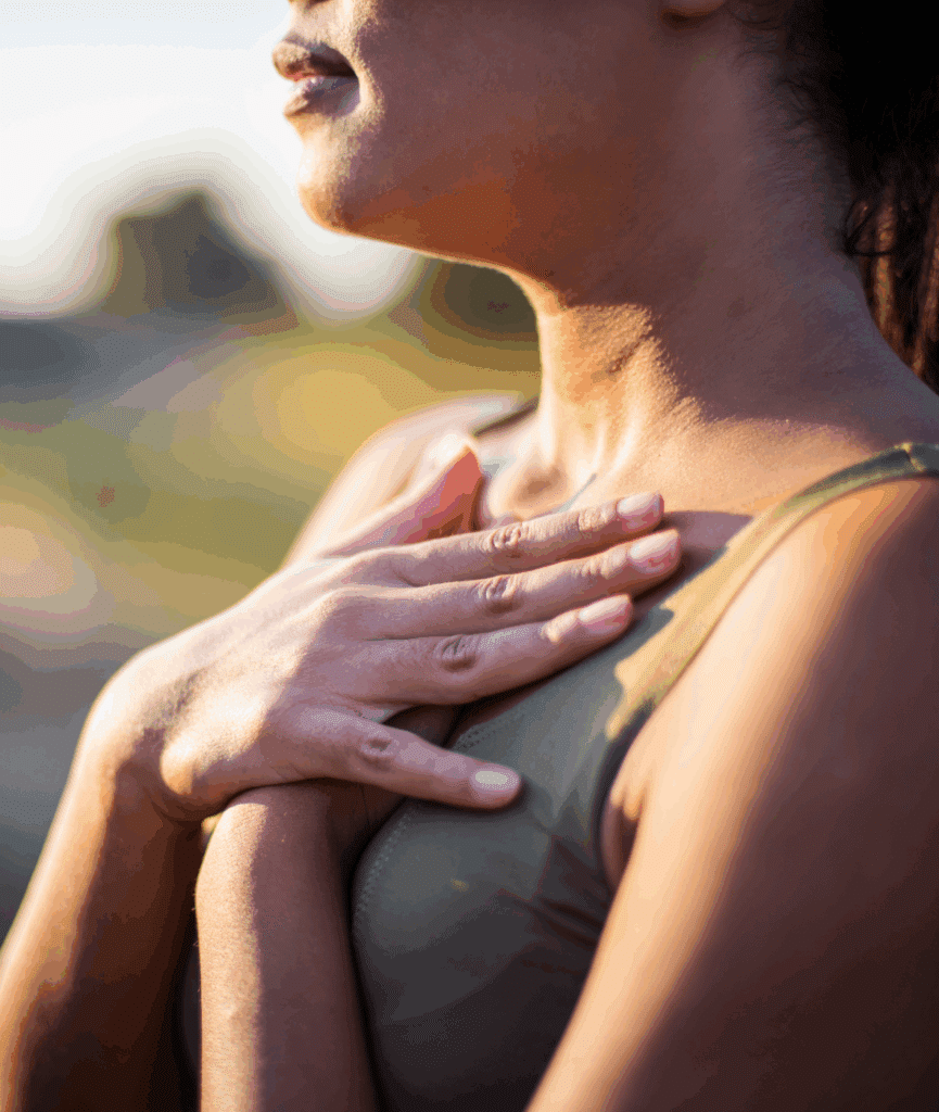 woman with hands on heart during mindfulness-based cognitive therapy sessions