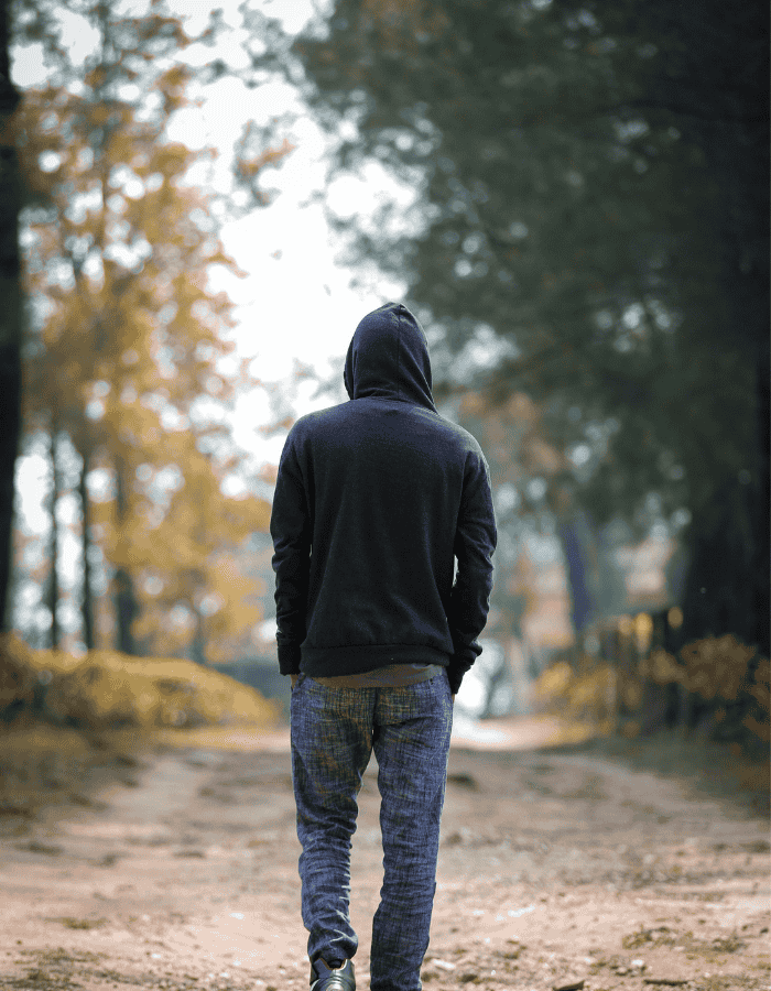 man with dissociative identity disorder and DID co-occurring disorders walking in the woods
