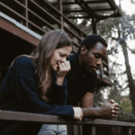 woman and man with types of adjustment disorders leaning on a balcony breaking up