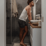 man looking in the mirror wondering what the narcissistic personality disorder symptoms are