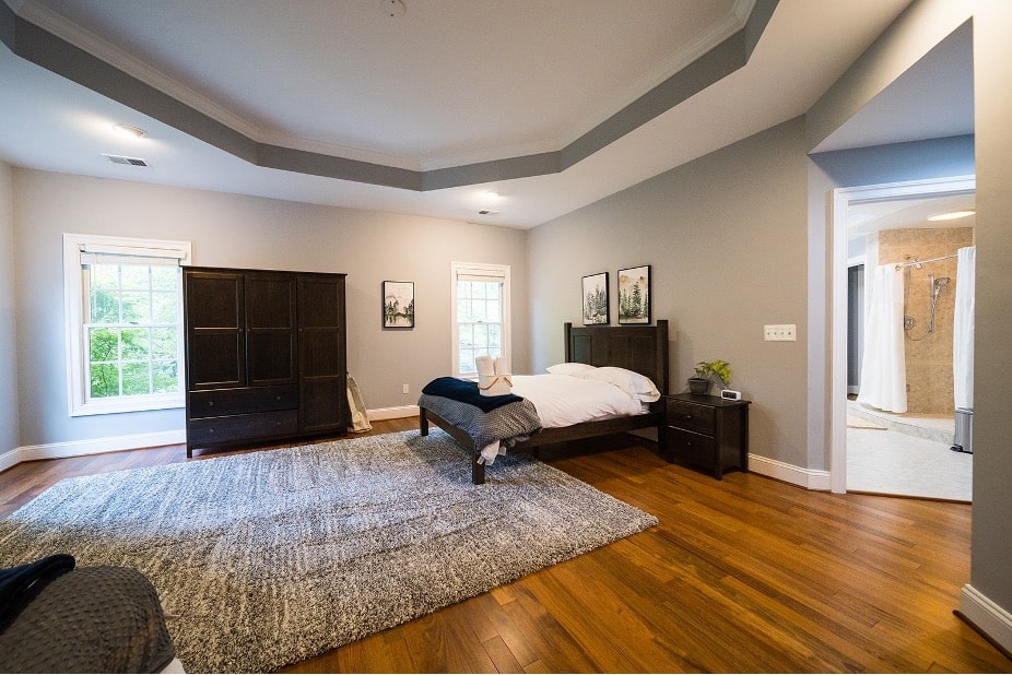 Modern open-concept Mission Connection living space with light wood floors and abundant natural light.