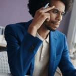 man sitting at desk frowning experiencing memory problems & brain fog in adults