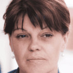 Close up of woman staring into space, experiencing dissociation in adults