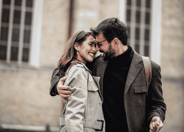 happy couple hugging and looking at each other after receiving treatment for jealousy & insecurity in adults