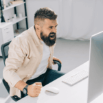angry man shouting at his laptop due to impulsivity symptoms