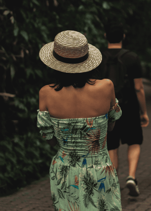 Woman walking behind a man experiencing fear of rejection in adults