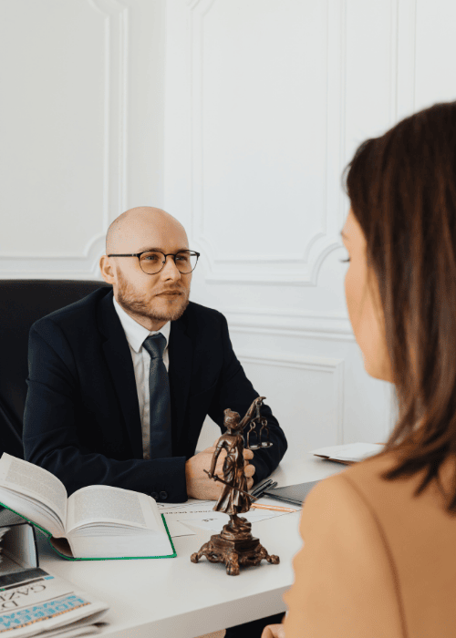 Woman sitting across from her boss experiencing distrust of authority in adults