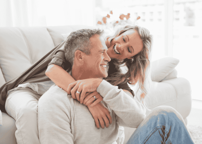 Man and woman looking at each other lovingly after receiving treatment for withdrawal after self-isolation after arguments