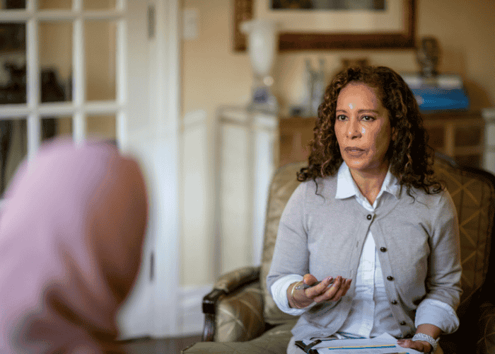 Woman in a therapy session after struggling with mental  health access challenges in rural Washington communities