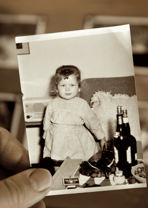 black and white photo of young girl being held by woman seeking support with childhood experiences and adult thought patterns