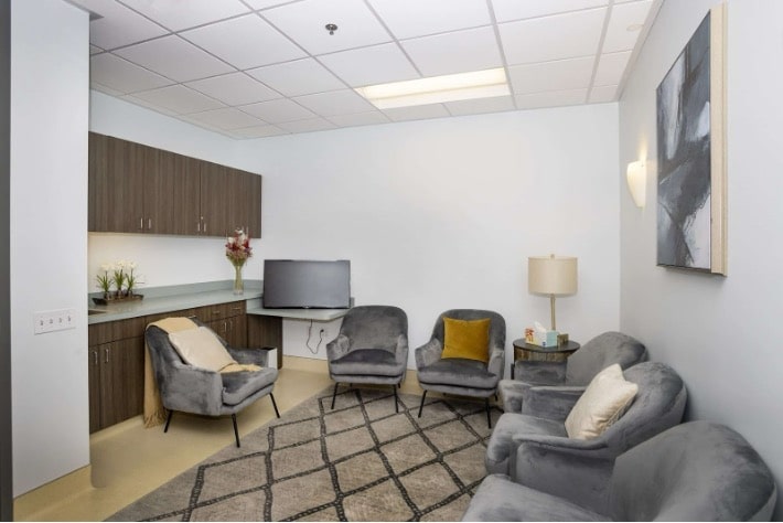 Mission Connection Healthcare's welcoming group therapy space features comfortable seating arranged for therapeutic sessions, natural lighting, and a calming environment designed for intensive outpatient treatment.