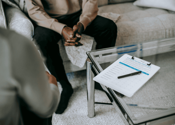 Man sitting in a therapy session after virginia mental health provider shortages