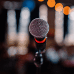 Standing in front of the microphone experiencing performance anxiety and negative thought loops