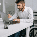 Man in a wheelchair struggling with work due to disability and mental health