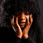 Woman of color upset due to racial trauma