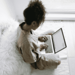 Woman accessing online therapy learning how telehealth helps rural/underserved communities