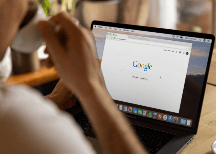 Person using laptop to search Google’s most asked mental health questions in 2025