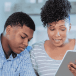 Man and woman using tablet for telehealth call after researching the future of mental health care