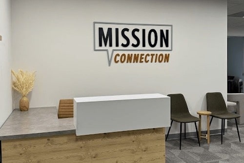 Mission Connection Healthcare reception room with our logo boldly crafted on the wall.