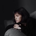 Woman looking sad due to cognitive distortions in OCD