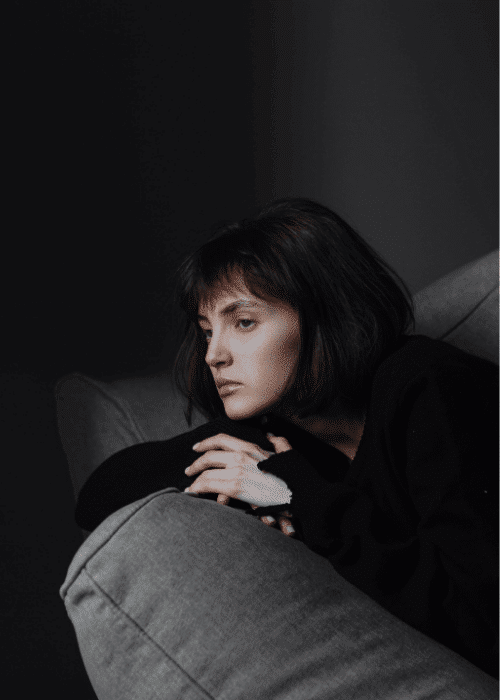 Woman looking sad due to cognitive distortions in OCD