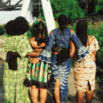 Women in colorful African dresses representing marginalized communities and mental health care