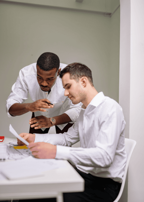 Two men discussing employer liability and mental health risk