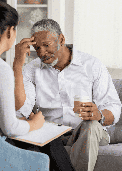 Man in therapy session needing support with workplace reintegration after leave