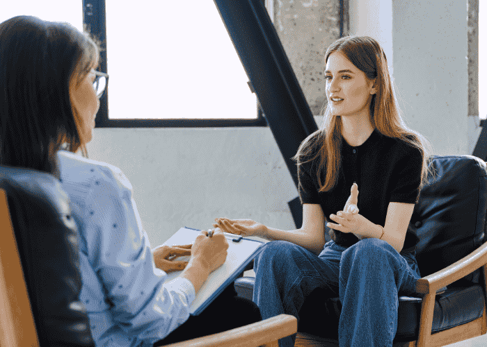 Woman in therapy session after finding support with therapist strikes