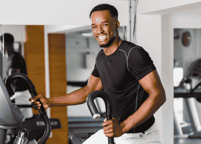 Man working out smiling after support with  ways to calm anxiety without medication