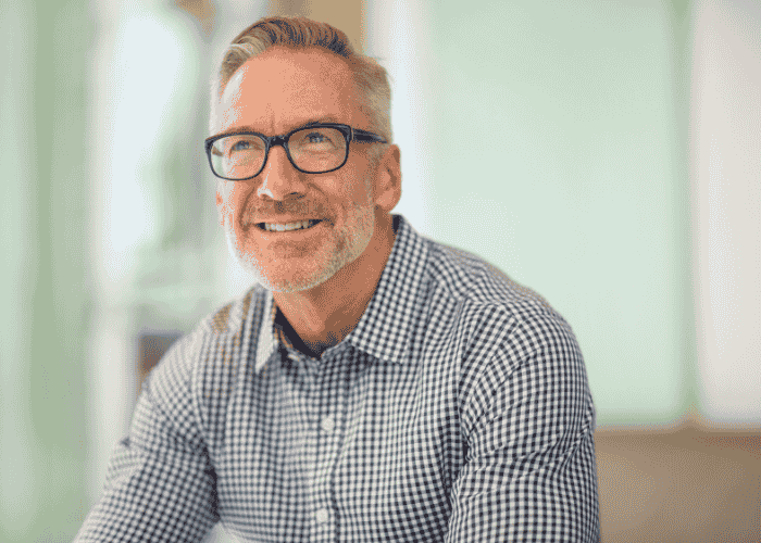 Man sitting smiling after receiving support with neurogenesis and antidepressants