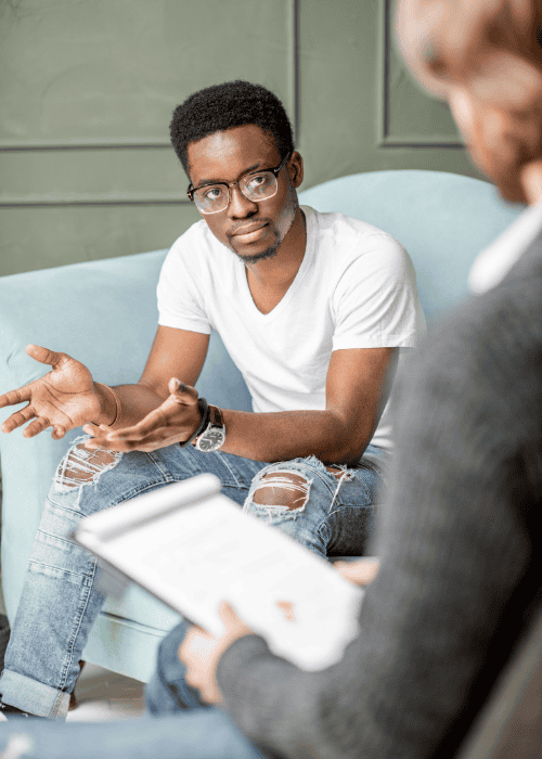Man in therapy session after mental health referrals from institutional workplace advocates