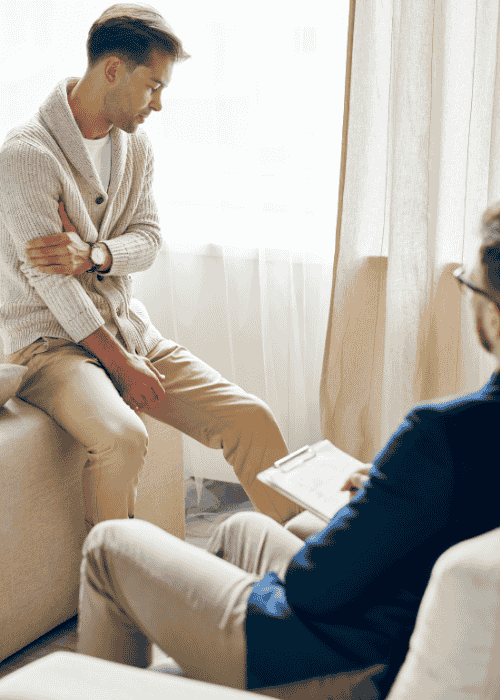 Man in a therapy session after mental health referrals from behavioral health practitioners