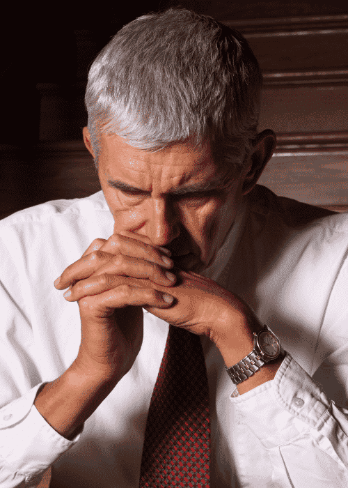 Man sitting head in hands needing support with dopamine and mood disorders