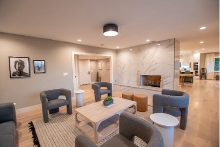 Welcoming lounge at a Mission Connection outpatient facility, with grouped seating arranged for group therapy and body doubling sessions.
