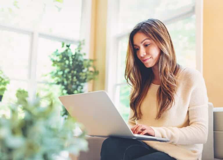 Woman looking at laptop during outpatient mental health treatment session